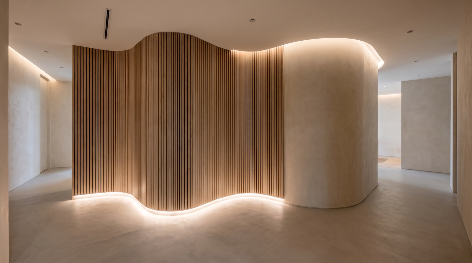 Sweeping curved white acoustic ceiling inside a modern Singapore commercial interior