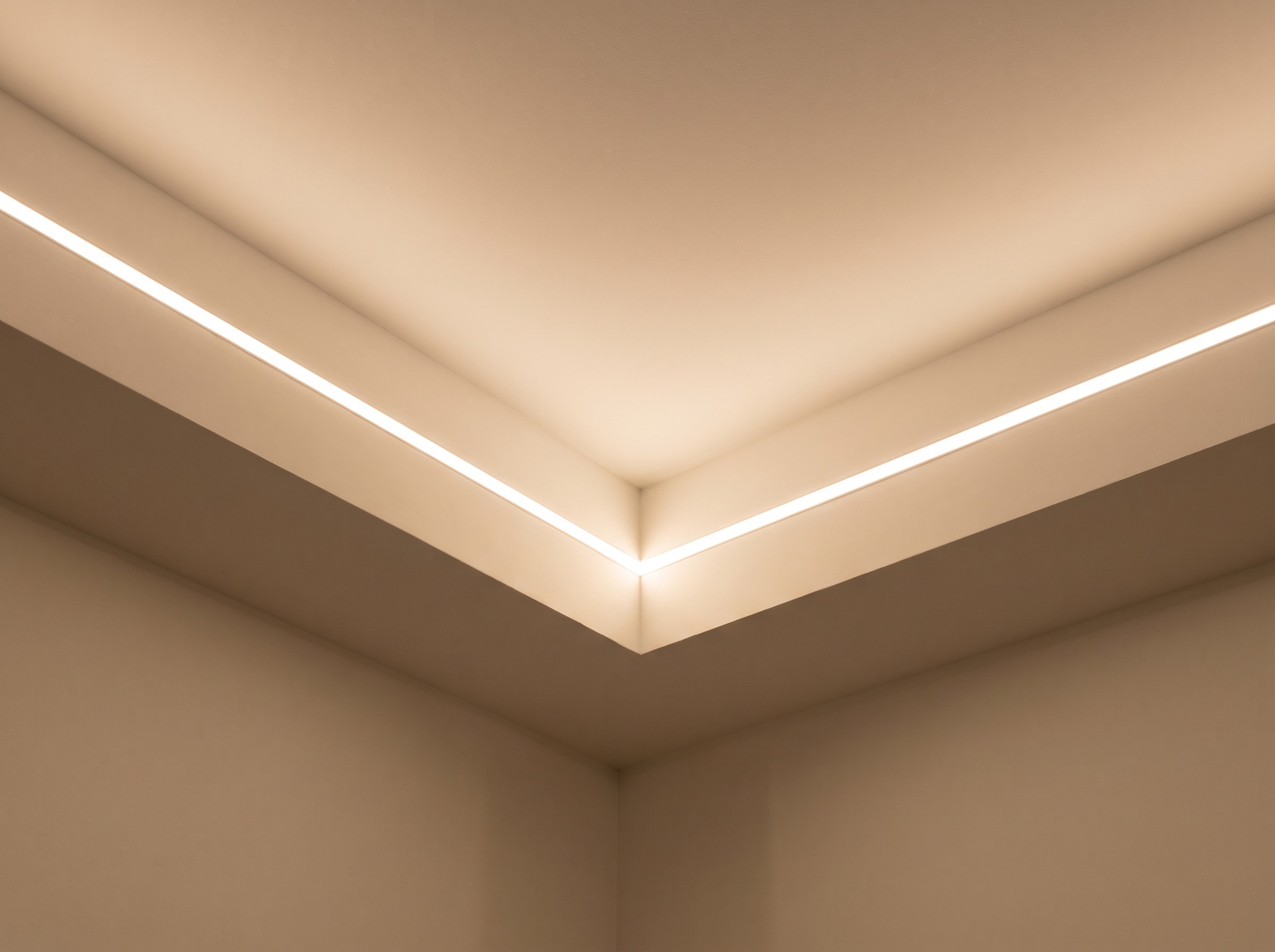 Cove lighting profile detail on a false ceiling corner, installed by Maynard